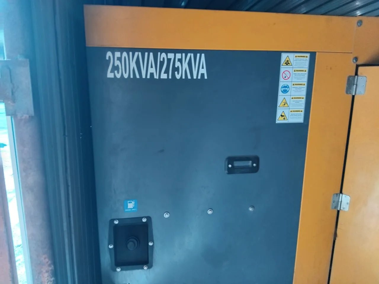 Canopy door of a large diesel generator marked 250 kVA / 275 kVA